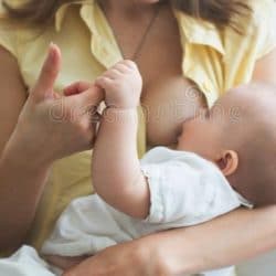 young-mother-holding-her-baby-boy-brestfeeding-him-sitting-young-mother-holding-her-baby-boy-brestfeeding-him-sitting-112198220~2